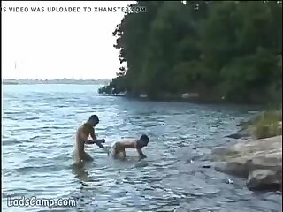 Steamy gay sex on the lake shore